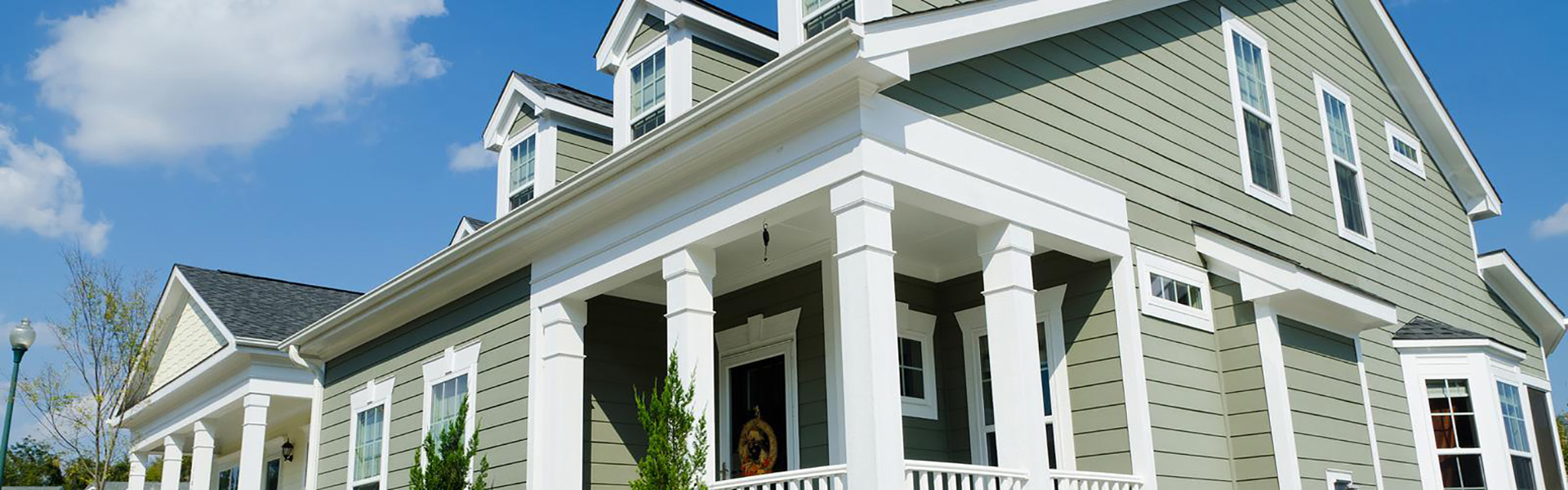 Home with light green siding